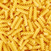 uncooked fusilli pasta background - food stock pictures, royalty-free photos & images
