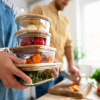 unrecognizable multiracial couple, preparing and storing vegetables for a weekly usage - food stock pictures, royalty-free photos & images