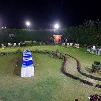 unrecognizable people walking in a garden after party is over at night. - garden decoration stock pictures, royalty-free photos & images