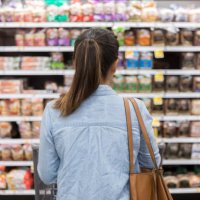 unrecognizable woman marvels at grocery bread selection - food stock pictures, royalty-free photos & images