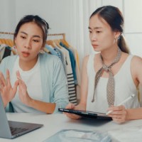 upset young asian women with laptop and tablet meeting check stock prepare order and plan shipping to customer at shop. - fashion stock pictures, royalty-free photos & images