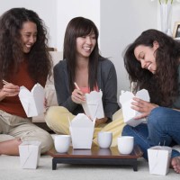usa, california, los angeles, three female friends eating take out food at home - junk food stock pictures, royalty-free photos & images