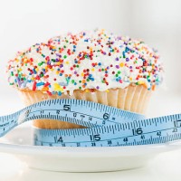usa, new jersey, jersey city, close up of cupcake with measuring tape - junk food stock pictures, royalty-free photos & images