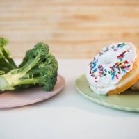 usa, new jersey, jersey city, donuts against broccoli - junk food stock pictures, royalty-free photos & images