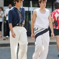 Valen Volinetts and Vova Volinetts wear white top, white trousers, taupe sandals, white and blue scarf on the waist , and blue sweater shorts sleeves...