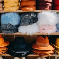 variation of headwear on shelves - fashion stock pictures, royalty-free photos & images