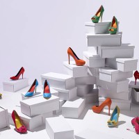 various shoes piled on shoe boxes - fashion stock pictures, royalty-free photos & images