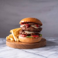 vegan double cheeseburger on light marble counter top. - junk food stock pictures, royalty-free photos & images