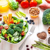 vegan food: healthy salad plate on white table. - food stock pictures, royalty-free photos & images