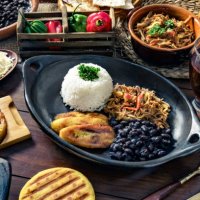 venezuelan traditional food, pabellon criollo with arepas, casabe and papelon with lemon drink - food stock pictures, royalty-free photos & images