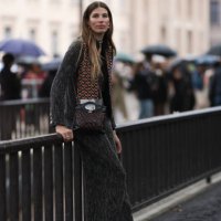 Veronika Heilbrunner is seen outside Chanel show wearing pearl earrings, grey tweed jacket and matching Chanel pants, burgundy and black crossbody...