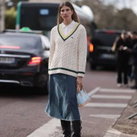 Veronika Heilbrunner seen wearing cream and black Lacoste sweater, white shirt, blue denim jeans skirt and black boots with tan and light blue bag...