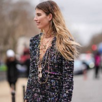 Veronika Heilbrunner wears a tweed colored jacket, Chanel necklaces, outside Chanel, during the Womenswear Fall/Winter 2024/2025 as part of Paris...