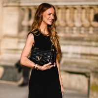 Victoria Magrath is seen wearing a black Louis Vuitton dressand black Louis Vuitton bag outside the Louis Vuitton show during Womenswear...