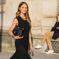 Victoria Magrath wears black dress, bag outside Louis Vuitton during Womenswear Spring/Summer 2025 as part of Paris Fashion Week on October 01, 2024...