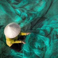 vietnam fishermen are repairing fishing nets - fashion stock pictures, royalty-free photos & images