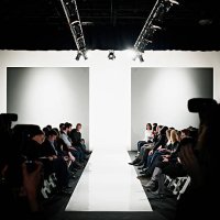 view down catwalk of photographers and crowd - fashion week stock pictures, royalty-free photos & images