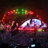 View from the crowd as Coldplay perform on the Pyramid Stage on the fourth day of the Glastonbury festival at Worthy Farm in the village of Pilton in...
