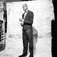 View of American basketball player Micheal Jordan as he poses, modeling samples from a line of formalwear, during a photo shoot, Chicago, Illinois,...