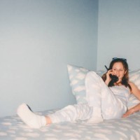 vintage teenage girl talking on telephone in 1990s bedroom cloud print y2k fashion 2000s - fashion stock pictures, royalty-free photos & images