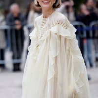 Violet Grace Atkinson wears butter yellow maxi ruffled dress, silver Chloe sunglasses, outside Zimmermann, during the Womenswear Fall/Winter...