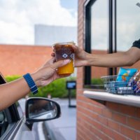 waiter deliver food throght drive thru service - junk food stock pictures, royalty-free photos & images