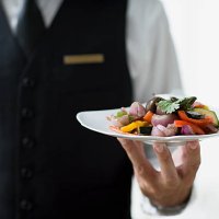 waiter holding plate - food stock pictures, royalty-free photos & images