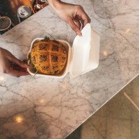 waiter preparing food delivery boxes - junk food stock pictures, royalty-free photos & images
