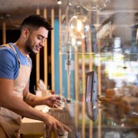 waiter working at a cafe preparing a delivery order - junk food stock pictures, royalty-free photos & images