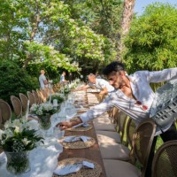 waiters setting banquet tables for wedding dinner in the backyard of the house - garden decoration stock pictures, royalty-free photos & images