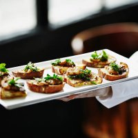 waitress holding platter of organic appetizers - food stock pictures, royalty-free photos & images