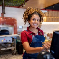 waitress working at a pizza place using the cash register - junk food stock pictures, royalty-free photos & images