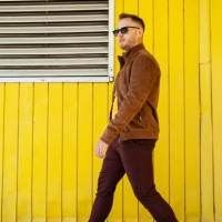 walking man in trendy outfit on street - fashion stock pictures, royalty-free photos & images