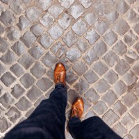 walking on cobblestone street wearing leather shoes in rome, directly above personal perspective view - fashion stock pictures, royalty-free photos & images