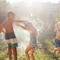 water bomb ballong fight on a hot summer day - garden decoration stock pictures, royalty-free photos & images