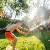 water fight in our yard - garden decoration stock pictures, royalty-free photos & images