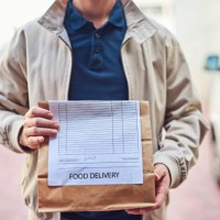 we deliver while it's still hot - junk food stock pictures, royalty-free photos & images