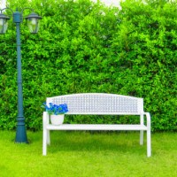 white bench with the bush background. white chair in the park. relaxation concept in the garden in morning time - garden decoration stock pictures, royalty-free photos & images