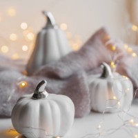 white decor pumpkin on windowsill on background of textured light sweaters in defocus - home decoration stock pictures, royalty-free photos & images