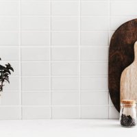 white kitchen background with kitchen utensils and green mint plant in pot - food stock pictures, royalty-free photos & images