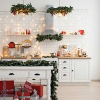 white kitchen interior with classic christmas decor and lights. - home decoration stock pictures, royalty-free photos & images