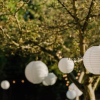 white lanters on a wedding in a garden - garden decoration stock pictures, royalty-free photos & images