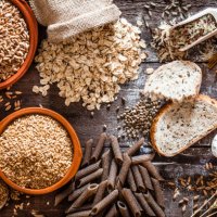 wholegrain food still life shot on rustic wooden table - food stock pictures, royalty-free photos & images