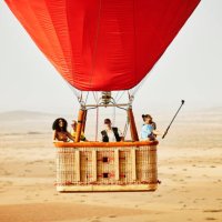 wide shot of family and friends on early morning hot air balloon ride - travel stock pictures, royalty-free photos & images