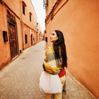 wide shot of woman exploring the medina of marrakech while on vacation - travel stock pictures, royalty-free photos & images