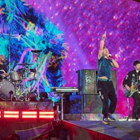 Will Champion, Chris Martin, and Guy Berryman of Coldplay perform at Rogers Stadium on July 07, 2025 in Toronto, Ontario.