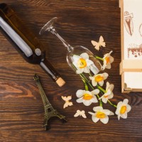 wineglass and bottle with decorative flowers and butterflies - garden decoration stock pictures, royalty-free photos & images