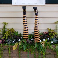 witch legs protrude from garden bed - garden decoration stock pictures, royalty-free photos & images