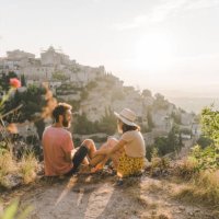 woman and man looking at scenic view of gordes village in provence - travel stock pictures, royalty-free photos & images
