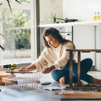 woman assembling furniture at home. - home decoration stock pictures, royalty-free photos & images